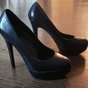 Black platform pumps